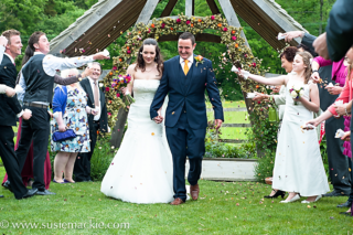 Outdoor wedding ceremony at Hyde House, Stow-on-the-Wold.  Floral design by Cotswold Blooms, wedding florist based in Cheltenham.