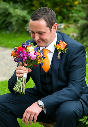 Bride’s bouquet and buttonhole designed with bright seasonal flowers.  Floral design by Cotswold Blooms, wedding florist based in Cheltenham.