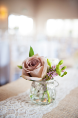 A mini display with Amnesia Roses, Freesia and Wax Flower. Floral design by Cotswold Blooms, wedding florist based in Cheltenham.