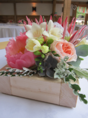 Coral peach and silver box displays at Cripps Barn. Floral design by Cotswold Blooms, wedding florist based in Cheltenham.