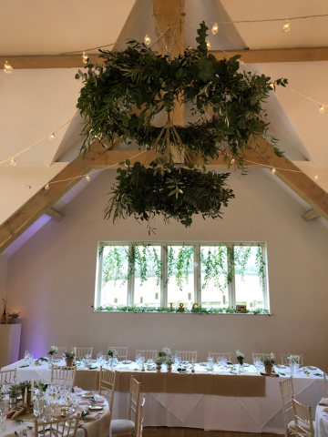 Foliage halo and window display at Hyde House, Stow-on-the-Wold.  Floral design by Cotswold Blooms, wedding florist based in Cheltenham.
