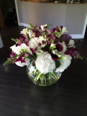 Burgundy and white fish bowl display. Floral design by Cotswold Blooms, wedding florist based in Cheltenham.