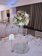 Rose and Wax Flower lily vase table centre at Manor by the Lake, Cheltenham. Floral design by Cotswold Blooms, wedding florist based in Cheltenham.