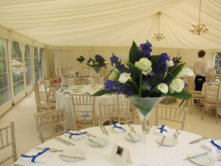 Blue and white flowers in a martini vase. Floral design by Cotswold Blooms, wedding florist based in Cheltenham.