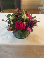 Hops, Wheat, Berries, mixed Foliage. Eustoma and Roses in a glass salad bowl. Floral design by Cotswold Blooms, wedding florist based in Cheltenham.