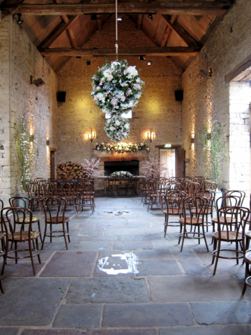Flower ball and mantel piece display designed in light blue, pink and white at Cripps Barn.  Floral design by Cotswold Blooms, wedding florist based in Cheltenham.