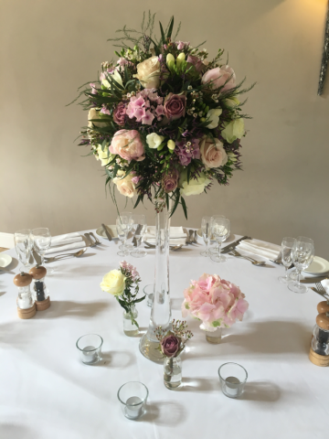 Lily vases and glass vases with Peonies, Roses and Waxflower in shades of pinks and whites. Floral design by Cotswold Blooms, wedding florist based in Cheltenham.