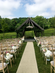 Outdoor wedding ceremony at Hyde House, Stow-on-the-Wold.  Floral design by Cotswold Blooms, wedding florist based in Cheltenham.