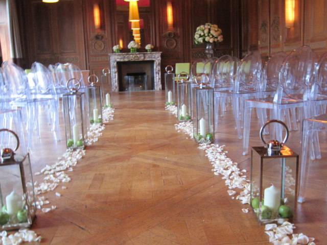 Lanterns and apples with a floating glass urn display at Cowley manor. Floral design by Cotswold Blooms, wedding florist based in Cheltenham.