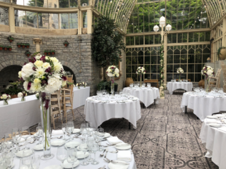 Calla Lilies and Hydrangea balls on Lily vases at Tortworth Court. Floral design by Cotswold Blooms, wedding florist based in Cheltenham.