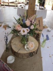 A country garden table display with dried crops at Cripps Barn. Floral design by Cotswold Blooms, wedding florist based in Cheltenham.