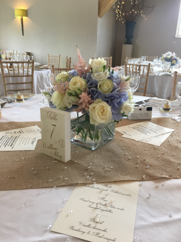 Light blue Hydrangea, pink Astilbe and white Roses at Hyde House, Stow-on-the-Wold. Floral design by Cotswold Blooms, wedding florist based in Cheltenham.