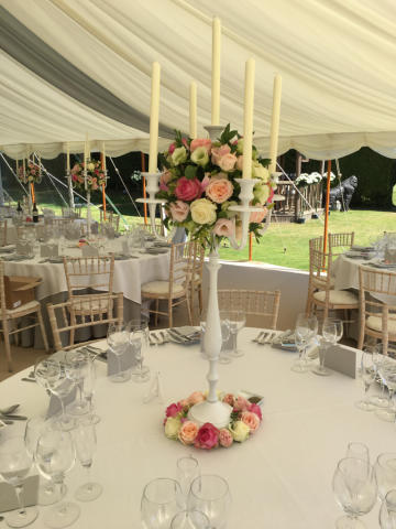 White candelabra with Rose balls. Floral design by Cotswold Blooms, wedding florist based in Cheltenham.