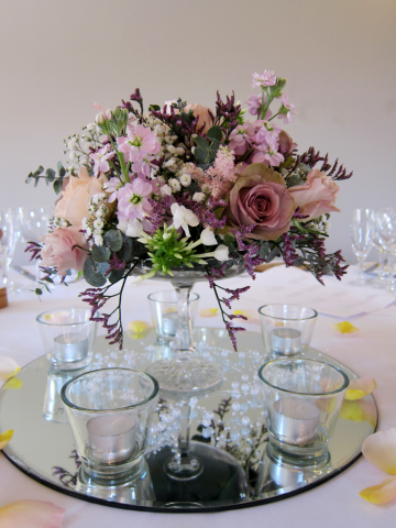 Stocks, Astilbe, Gypsophila and Phlox create this table display. Floral design by Cotswold Blooms, wedding florist based in Cheltenham.