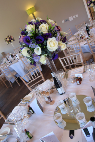 Lilac, purple and white lily vase display. Floral design by Cotswold Blooms, wedding florist based in Cheltenham.