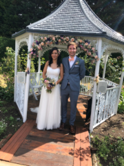 Bridal bouquet, buttonhole and floral arch designed with Roses, Agapanthus and Astilbe at Hockwold Hall, Norfolk. Floral design by Cotswold Blooms, wedding florist based in Cheltenham.