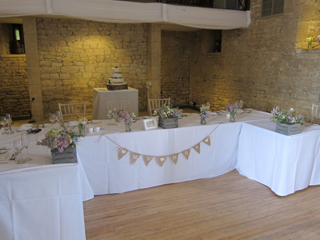 Rustic box displays at the Great Tythe Barn, Tetbury. Floral design by Cotswold Blooms, wedding florist based in Cheltenham.