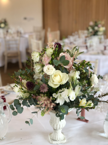 Mini urn display in white with dusky light pink and burgundy including Delphinium, Allium, Astrantia, Astilbe and Eucalyptus. Floral design by Cotswold Blooms, wedding florist based in Cheltenham.