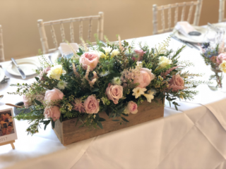 Rustic box filled soft pink Roses, Peonies and Wax Flower.  Floral design by Cotswold Blooms, wedding florist based in Cheltenham.