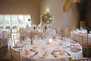 Gypsophila and Rose lily vase display at Hyde House. Floral design by Cotswold Blooms, wedding florist based in Cheltenham.