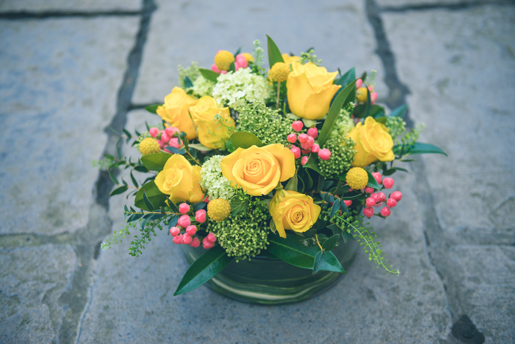 Salad bowl table centrepiece in vivid yellow, coral and lime green tones