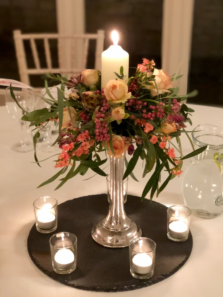 Trailing flowers around a candle stand at Hyde House, Stow-on-the-Wold