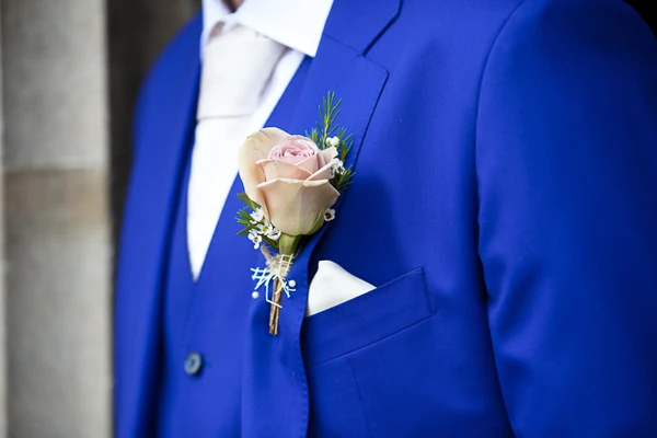 Elegant Amnesia rose buttonhole with delicate waxflower