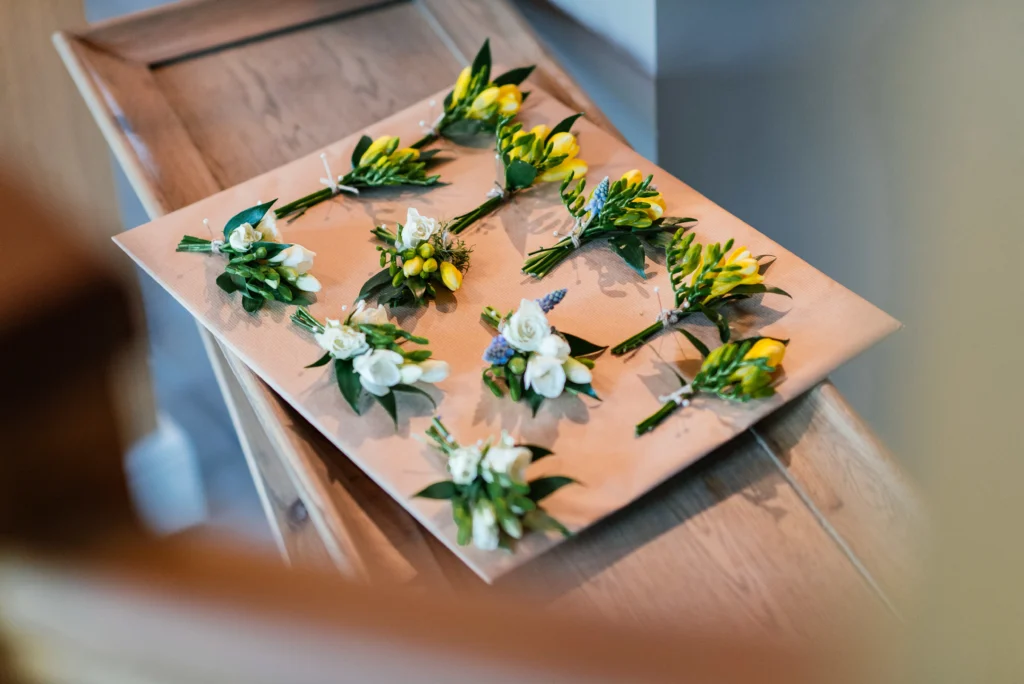 Bohemian wedding buttonholes featuring freesia