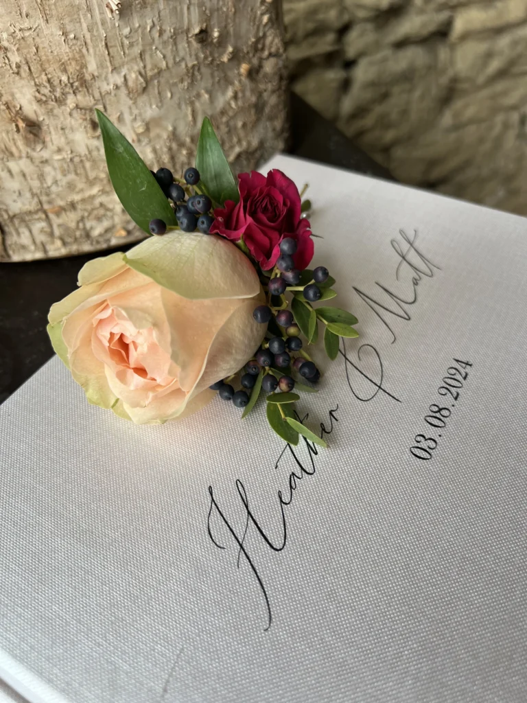 Roses with viburnum berries, featuring peach and pink rose tones