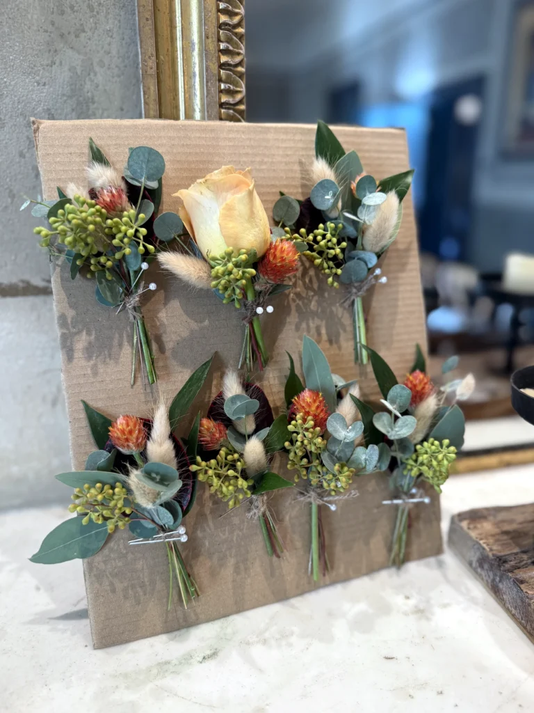Groom and groomsmen buttonholes with bunny tail detail