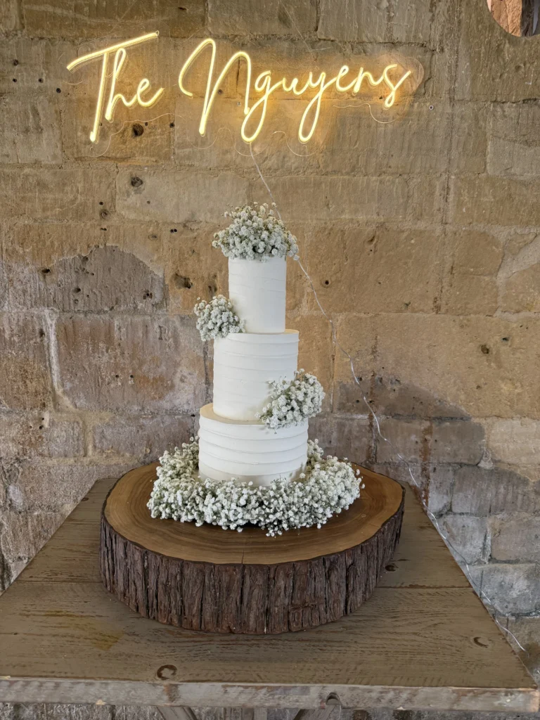 Wedding cake decorated with gypsophila at Lapstone Barn