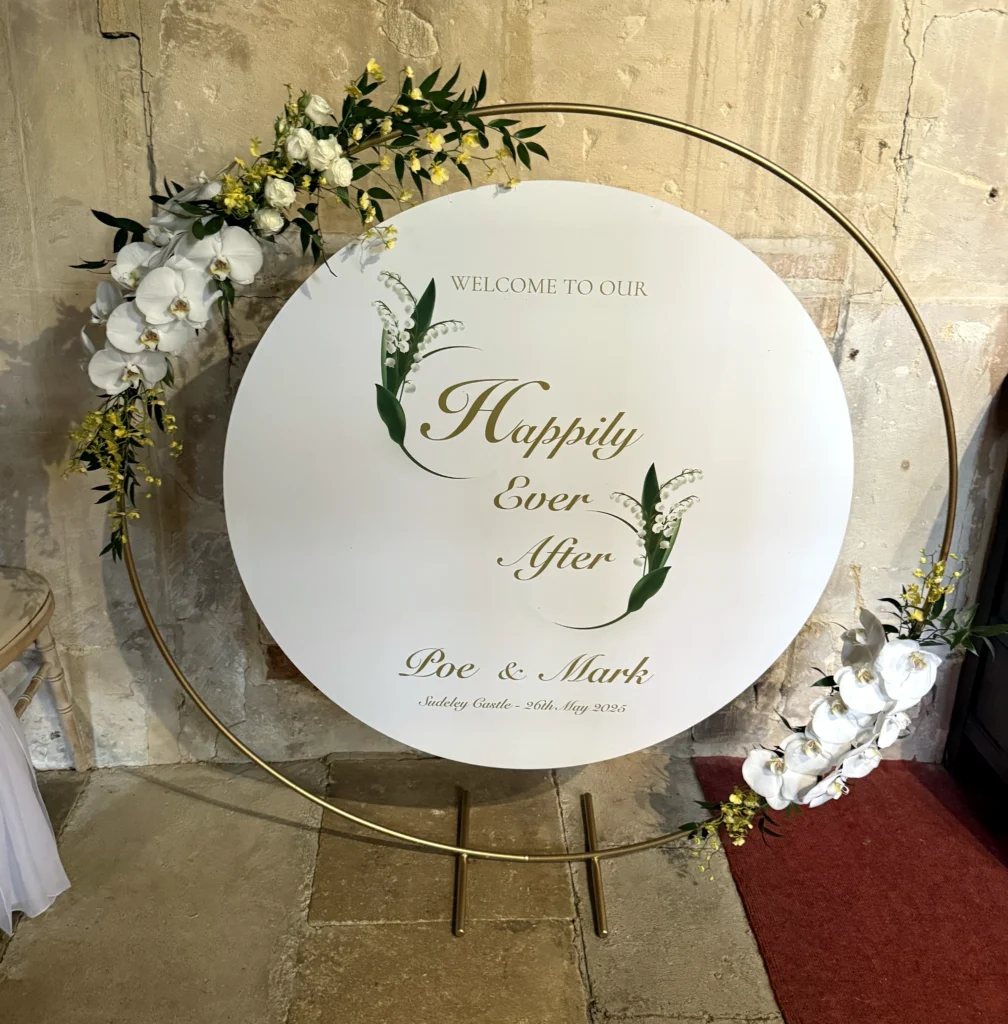 Orchid-adorned moon gate welcome sign