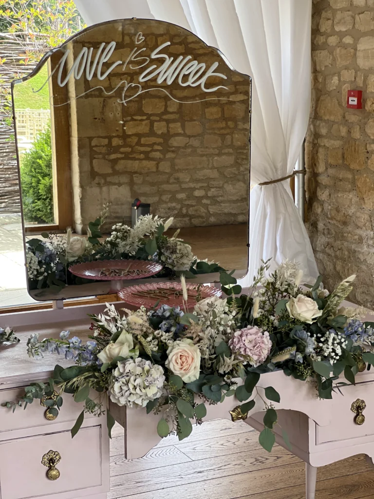 Floral arrangement flowing out of a vintage-style drawer