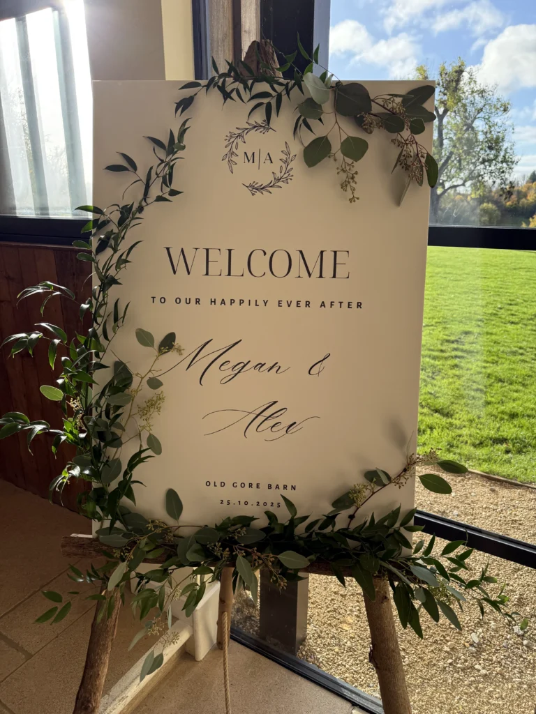 Floral welcome sign with natural foliage detail
