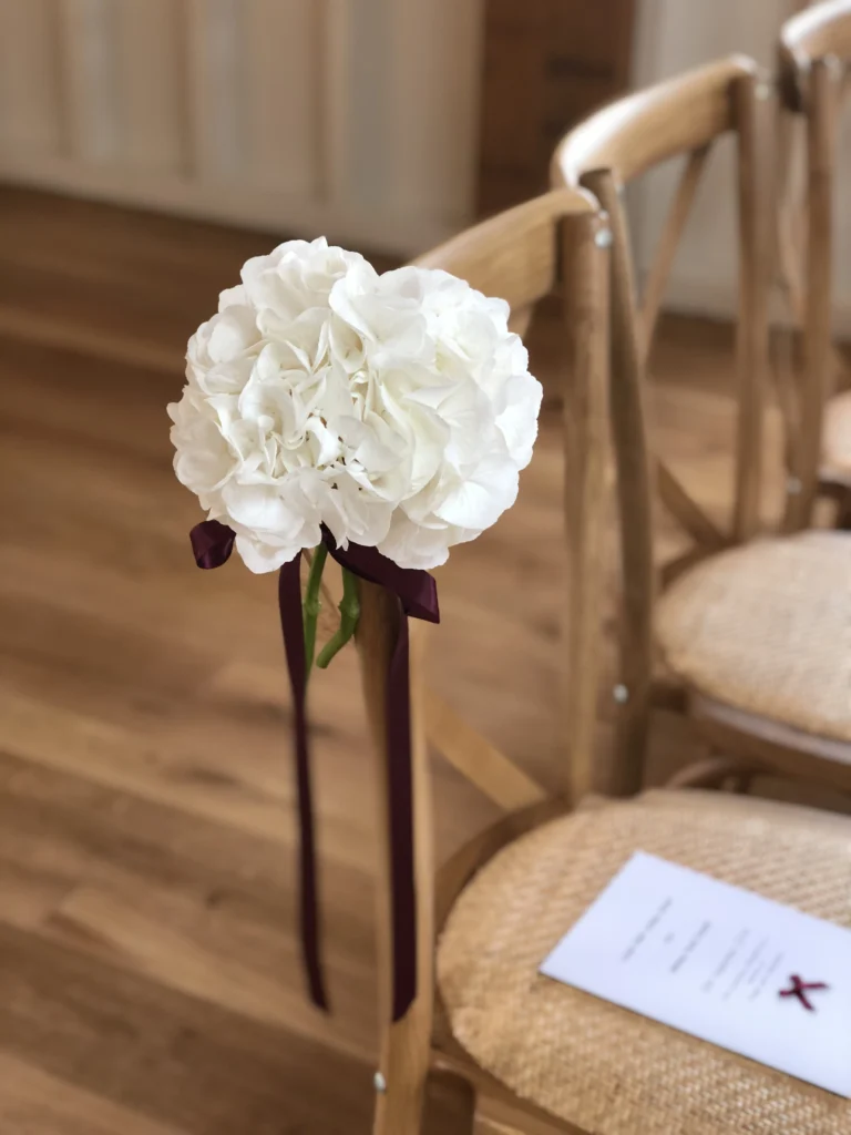 Hydrangea aisle marker with burgundy ribbon