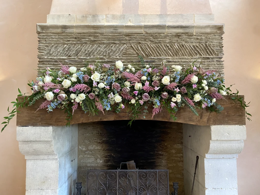 Oxleaze Barn fireplace dressed with boho floral styling