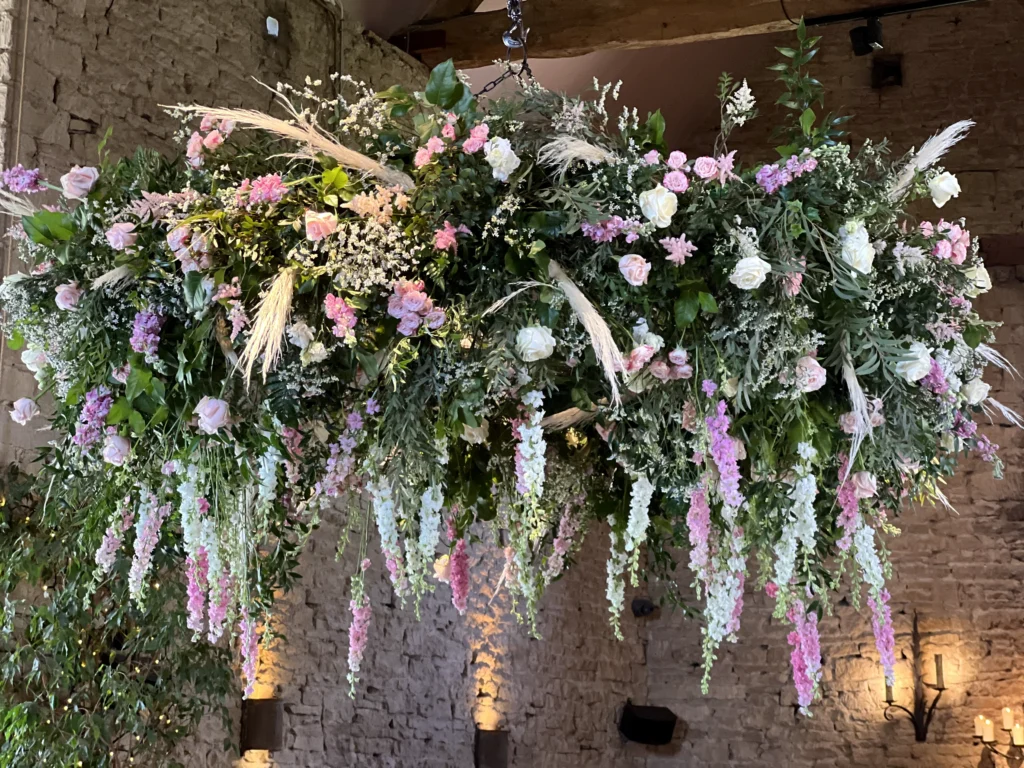Statement halo installation with delphinium and pampas grass at Cripps Barn