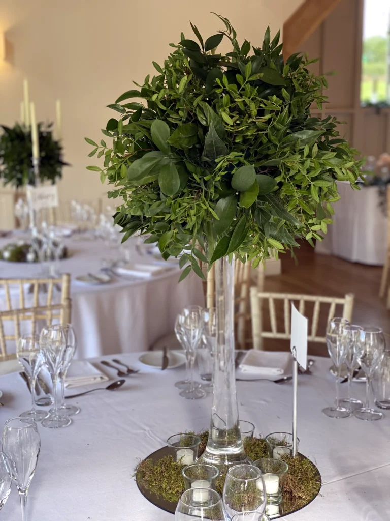 Wedding tall foliage styling with candles