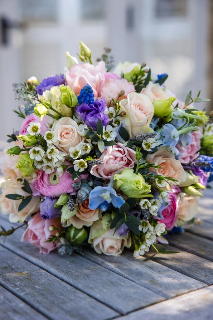 Luxury bridal bouquet with roses and seasonal flowers in the Cotswolds