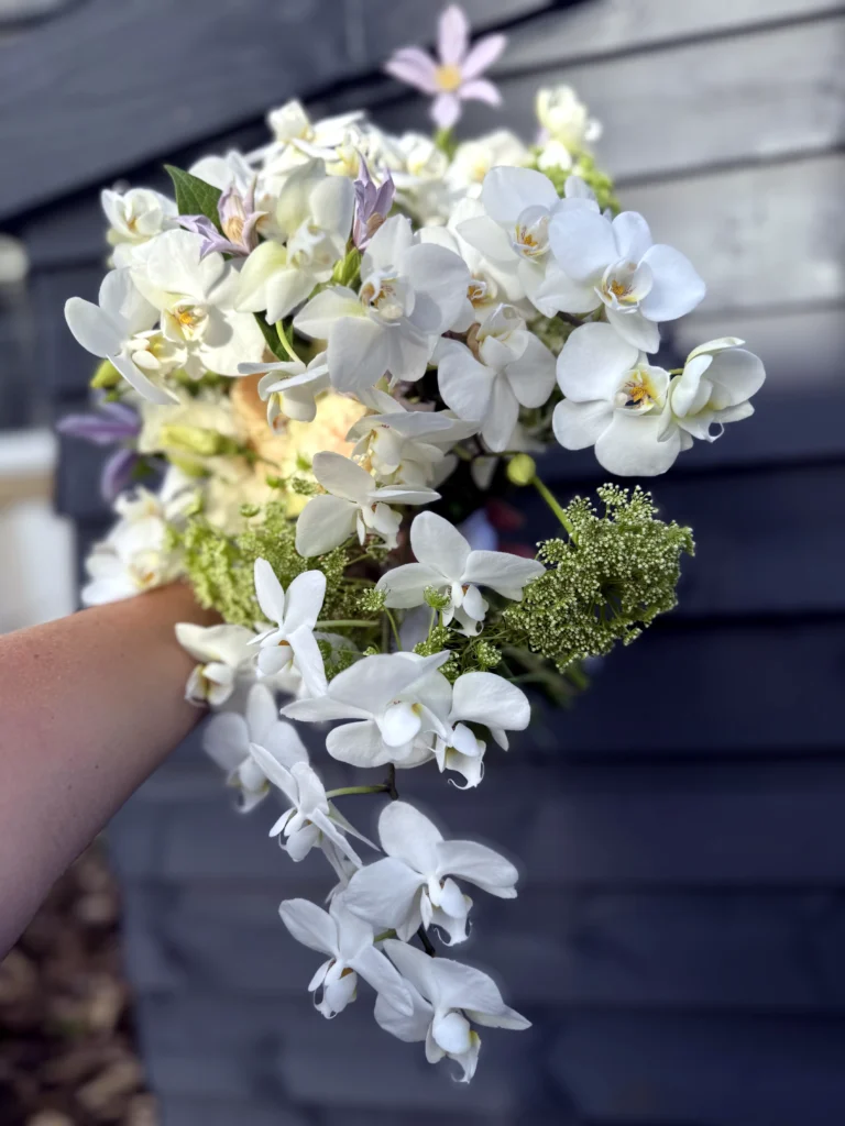 Trailing orchid bridal bouquet with roses