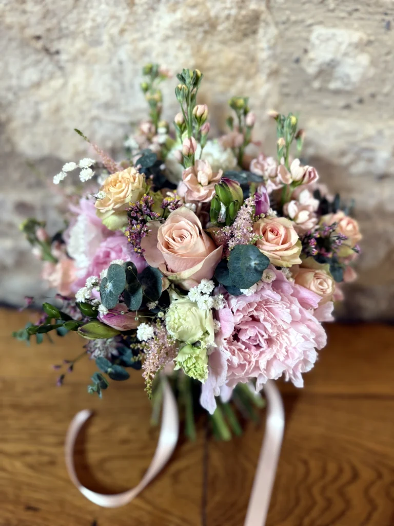 pastel bridal bouquet with peonies and locally sourced seasonal flowers