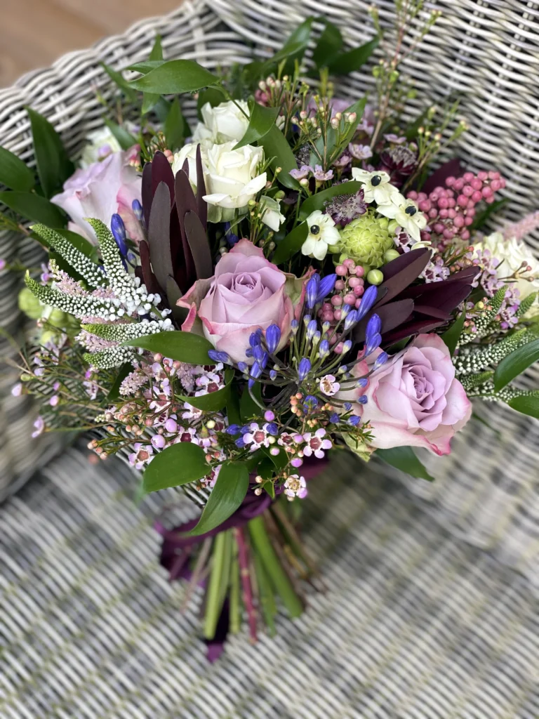 Textured hand tied bouquet for a lilac and purple themed wedding
