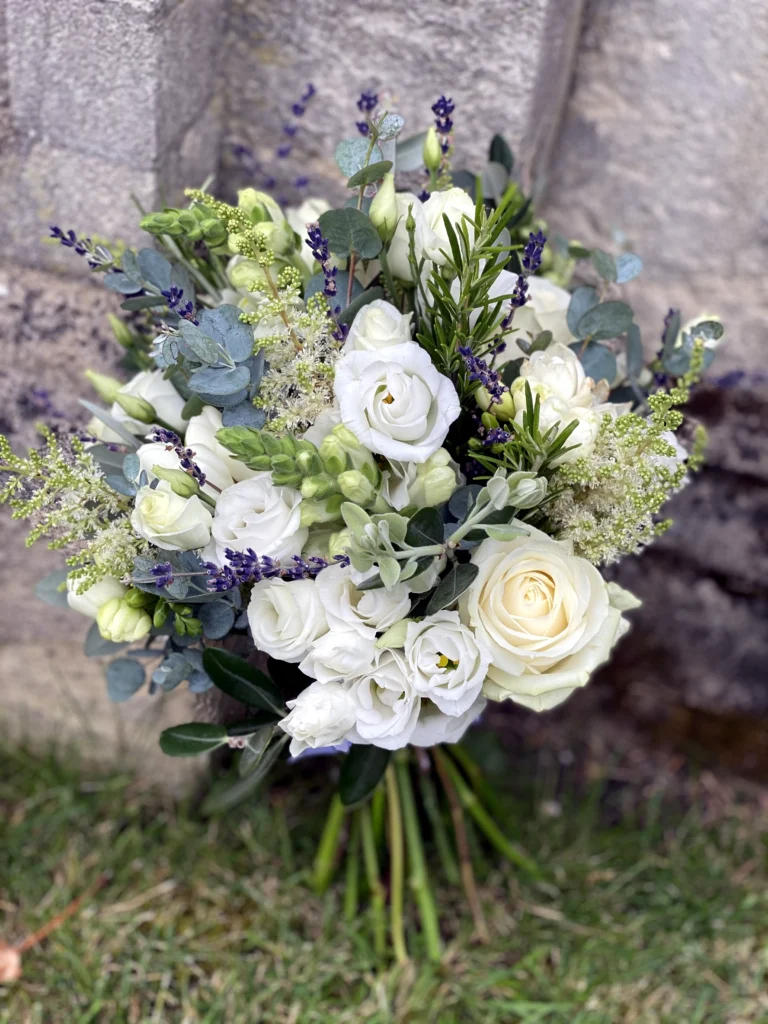 Classic white wedding bouquet with a touch of lavender