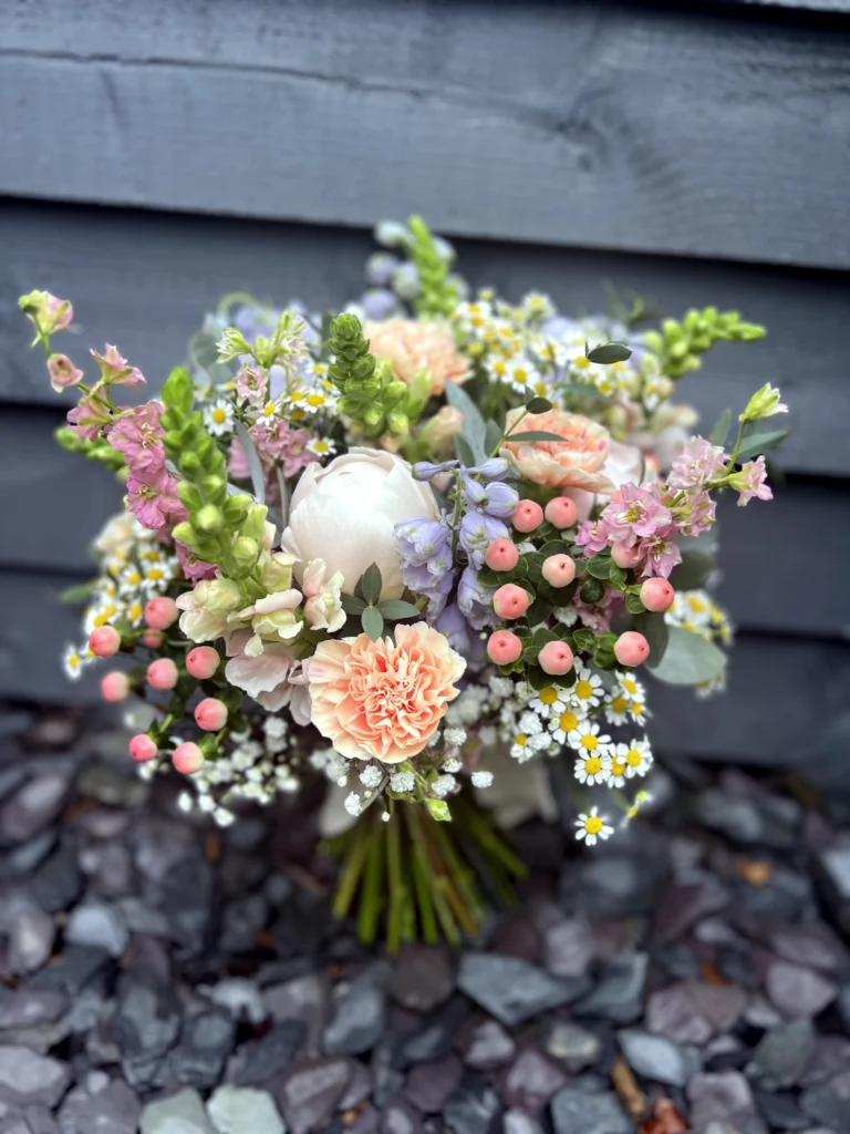Sorbet shades in a country garden wedding bouquet