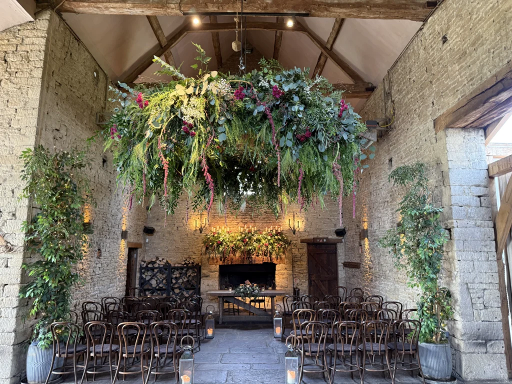 Floral halo feature with trailing amaranthus at Cripps Barn wedding venue