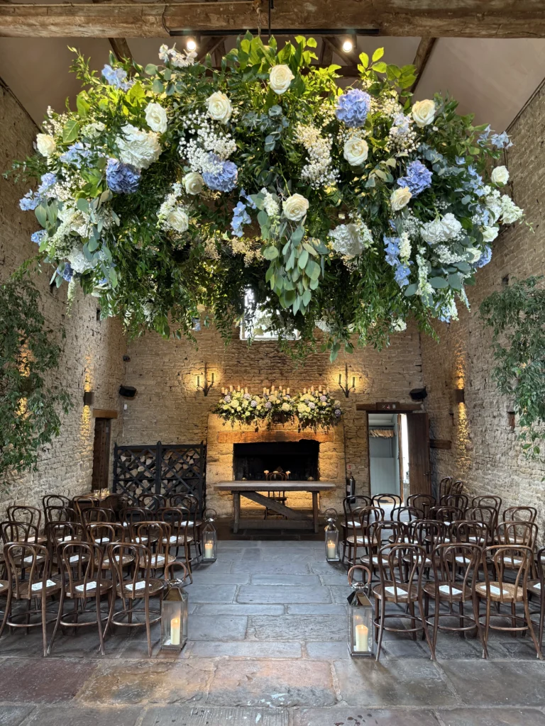 Large hanging floral wedding design by Cotswold Blooms at Cripps Barn
