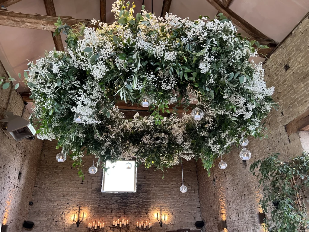 Large hanging floral wedding design by Cotswold Blooms at Cripps Barn