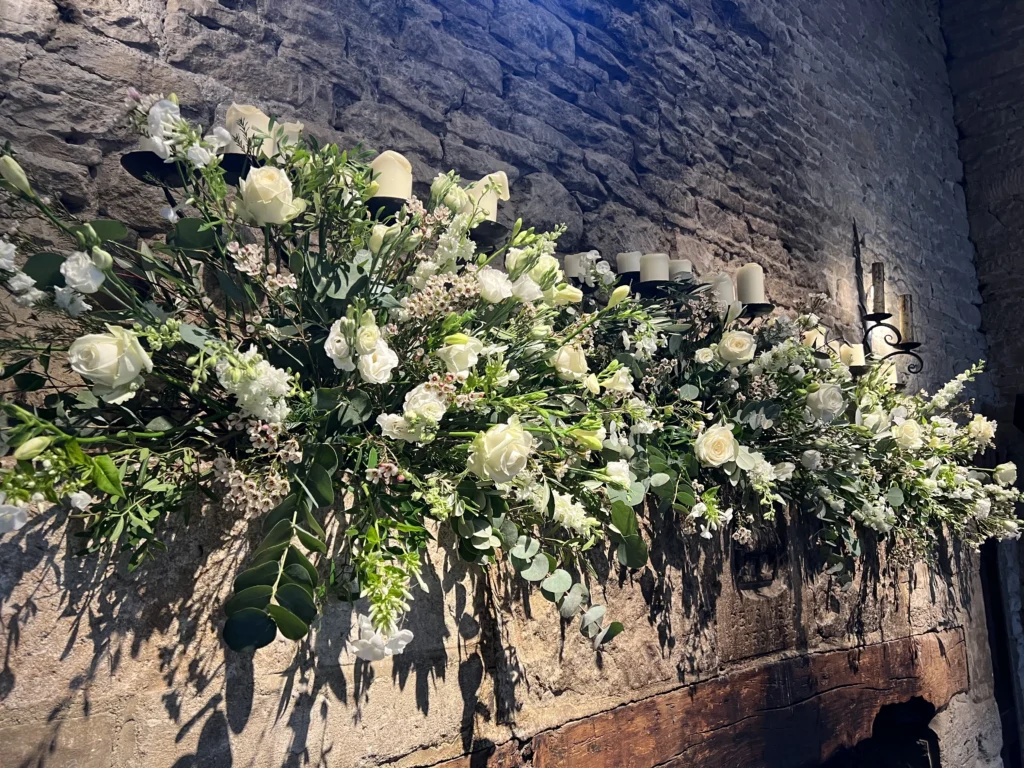 Floral installation in barn at Cripps Barn, Bibury