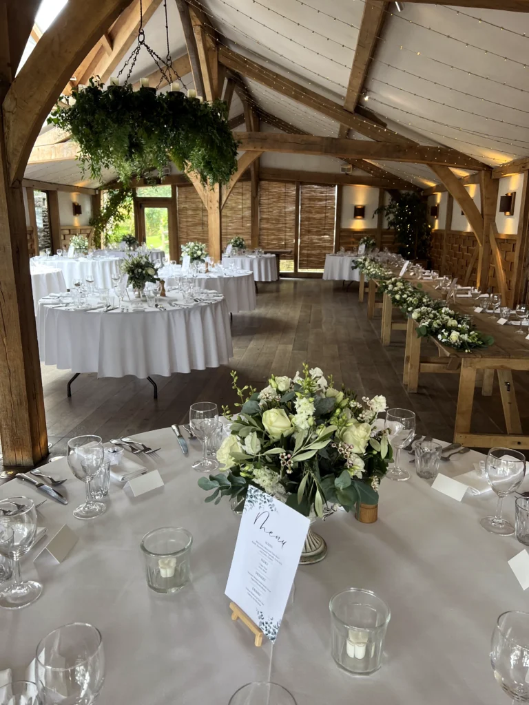 Reception table flowers at Cripps Barn wedding