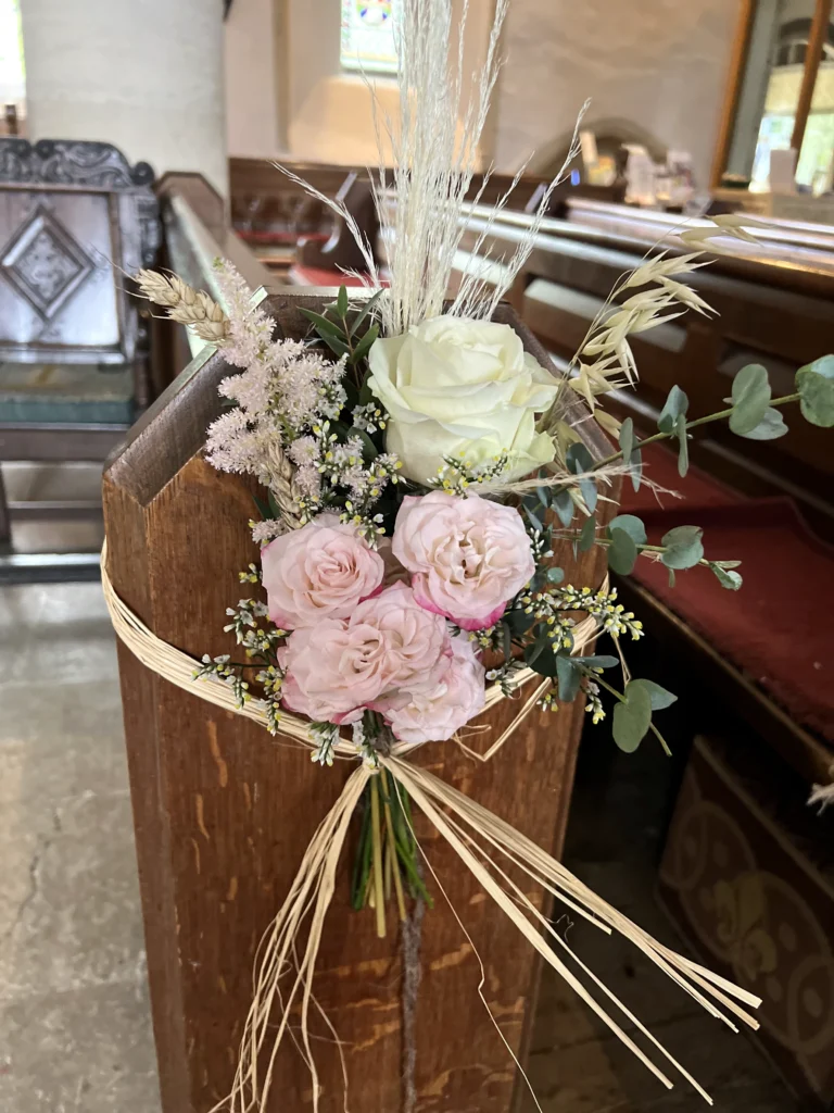 Boho wildflower aisle markers for a rustic church wedding ceremony